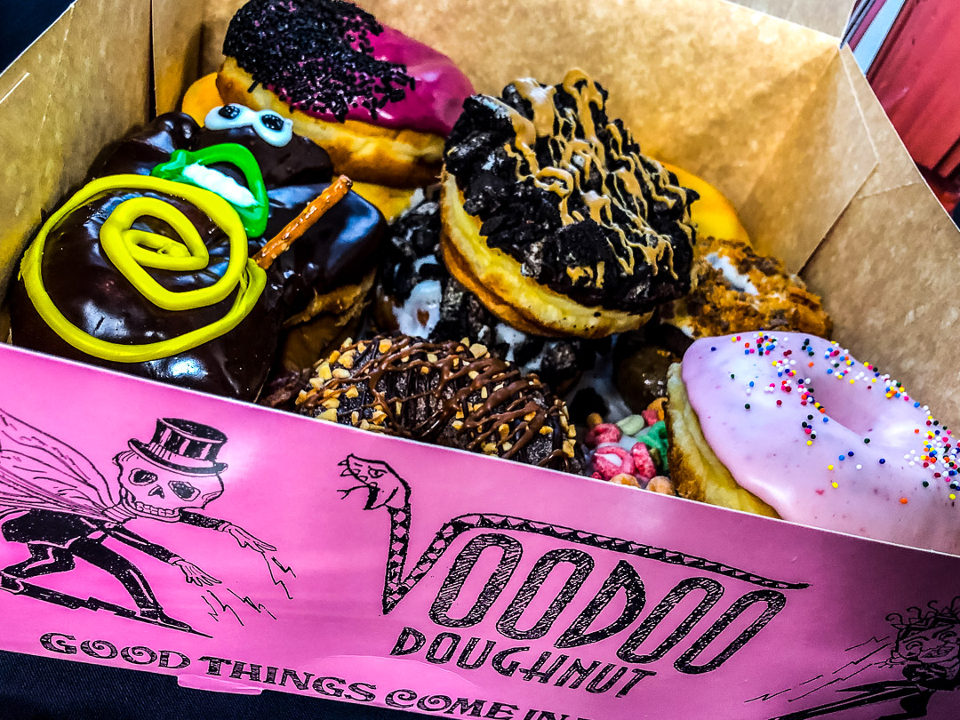 A street photograph showing Voodoo Doughnuts