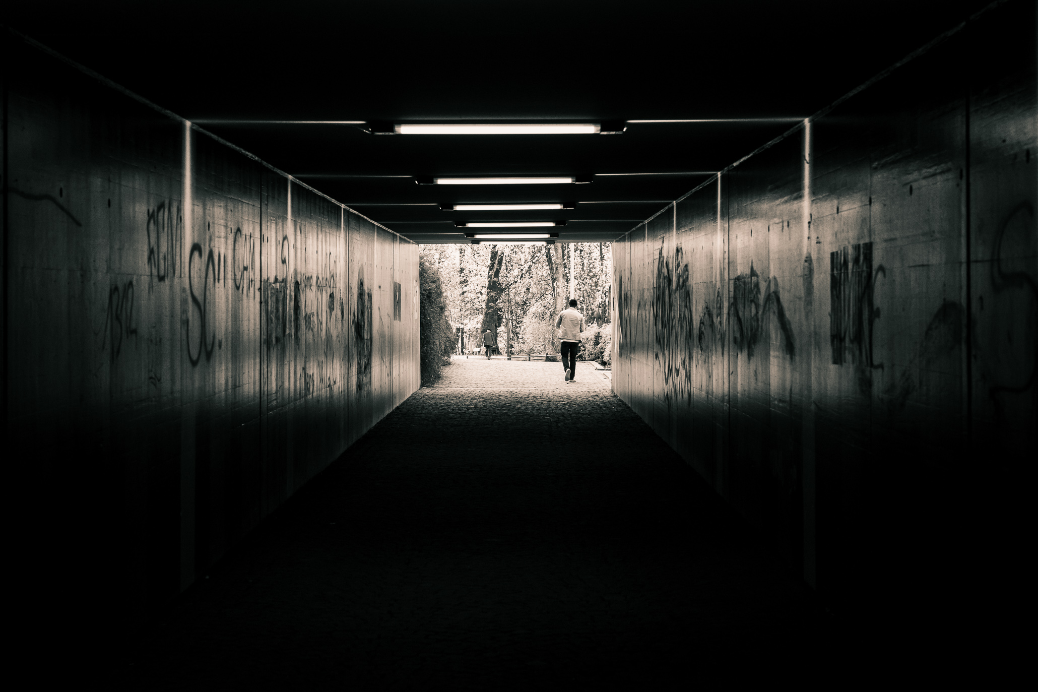 Man walking out of a tunnel into the light. And this is the end of my journey with Leica. 