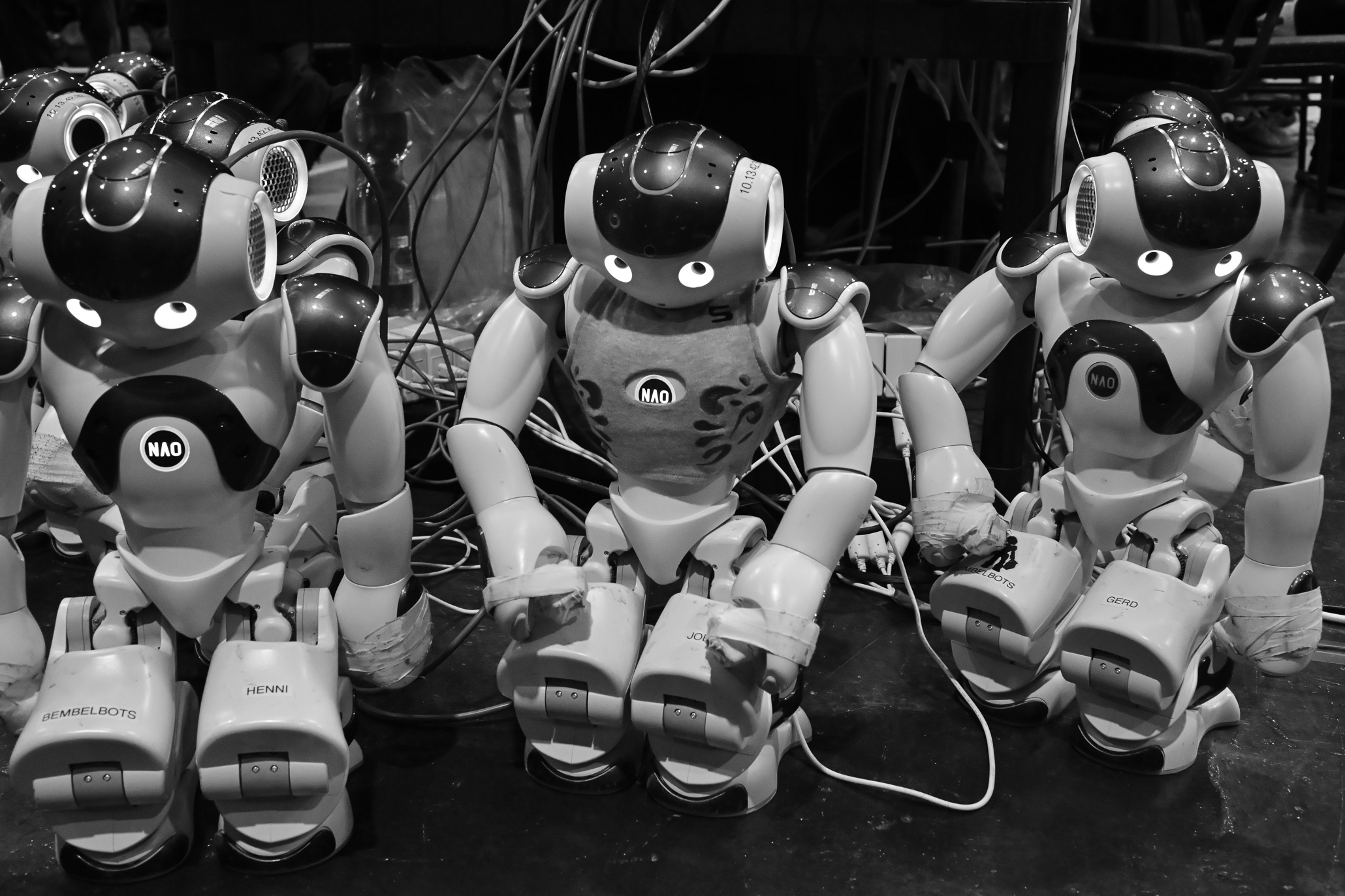 I robot - monochrome photograph of three little robots