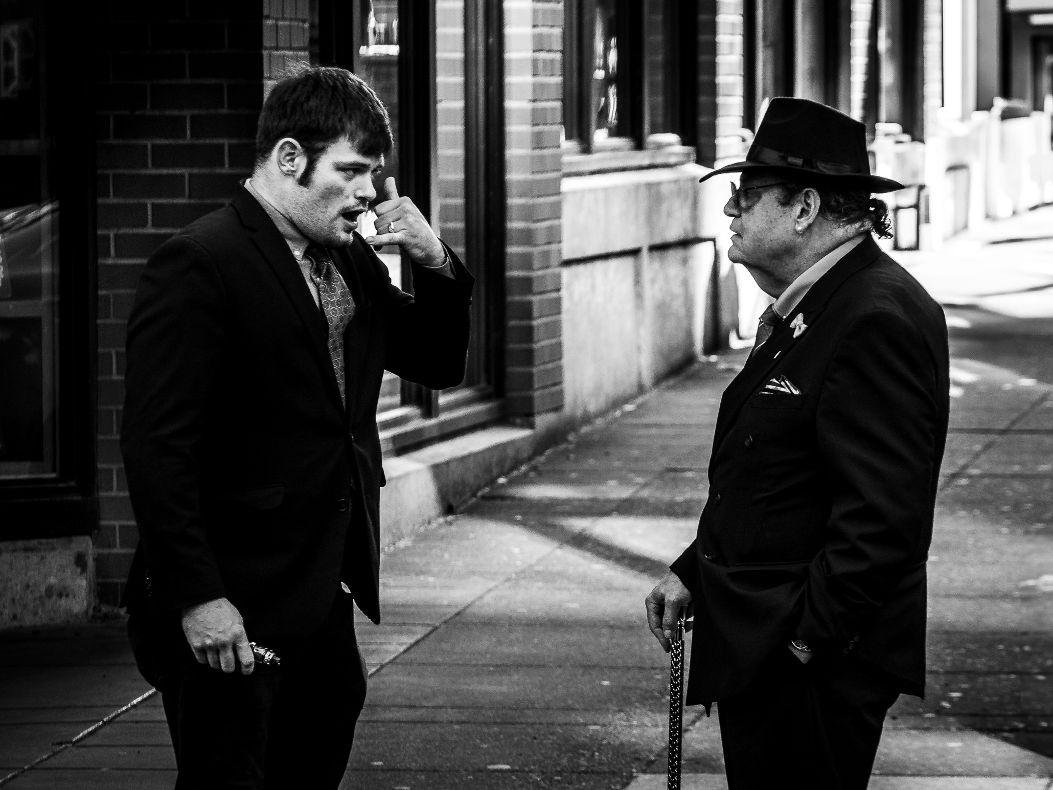 Call me, one gentleman seems to tell another with a universal gesture